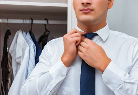 The businessman dressing up for workの写真素材