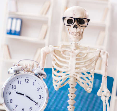 Skeleton businessman working in the office