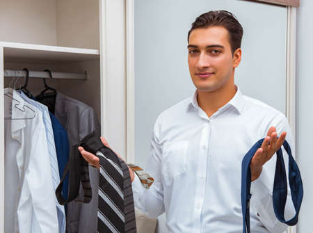 Businessman dressing up for workの写真素材