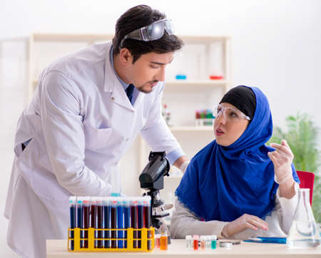 Two chemists working in the labの写真素材