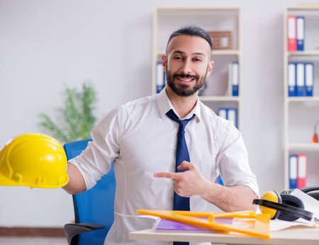 Architect working in his studio on new project