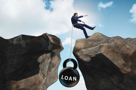 Concept of debt and load with businessmanの写真素材