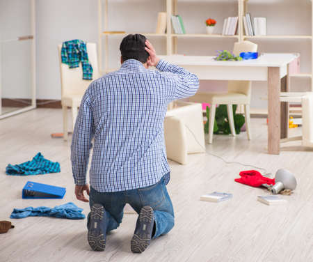 Man found his house after burglary robbed by burglarsの写真素材