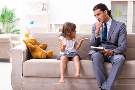 Child psychologist attending small girlの写真素材