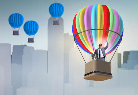 Businessman flying on balloon in challenge conceptの写真素材