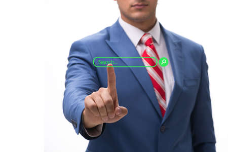 Search concept with the businessman pressing button
