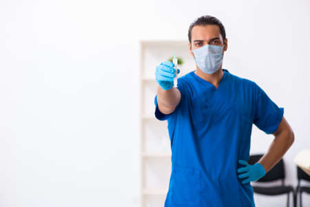 Young male doctor working in the clinicの写真素材