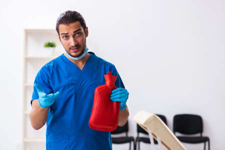 Young male doctor working in the clinicの写真素材