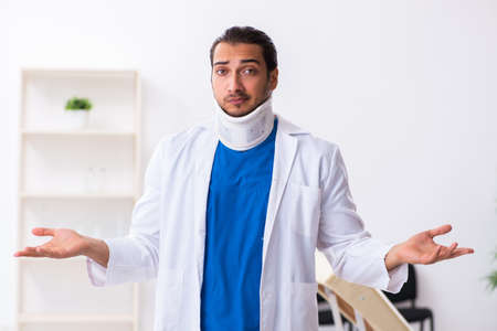 Young male doctor working in the clinicの写真素材