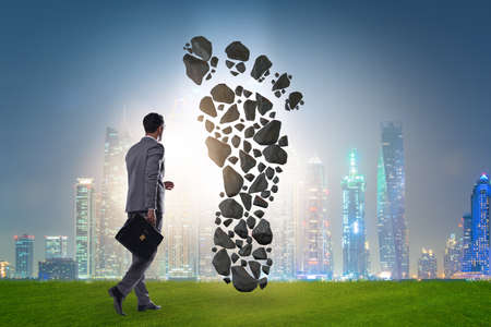 Carbon footprint concept with businessmanの写真素材