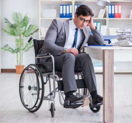 Disabled businessman working in the officeの写真素材