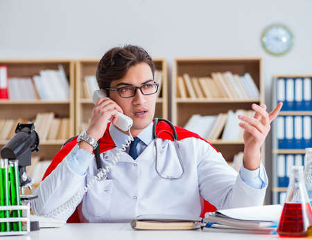 Superhero doctor working in the hospital labの写真素材