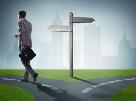 The businessman in difficult choice conceptの写真素材