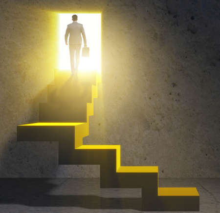 The young businessman climbing career ladderの写真素材