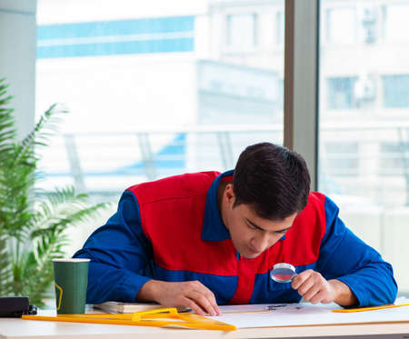 Foreman looking at construction planの写真素材