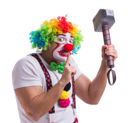 The funny clown with a hammer isolated on white backgroundの写真素材