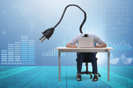 The businessman losing energy to workの写真素材