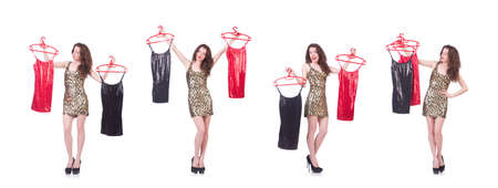 The woman trying new clothing on whiteの写真素材