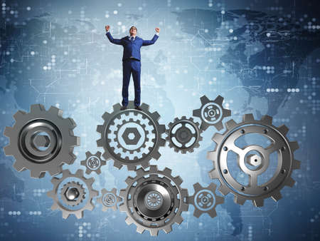 Businessnman in teamwork concept with cogwheels