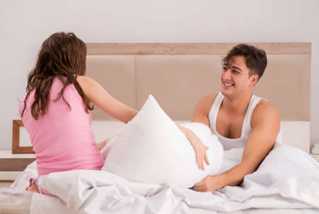 Family conflict with wife husband in bedの写真素材