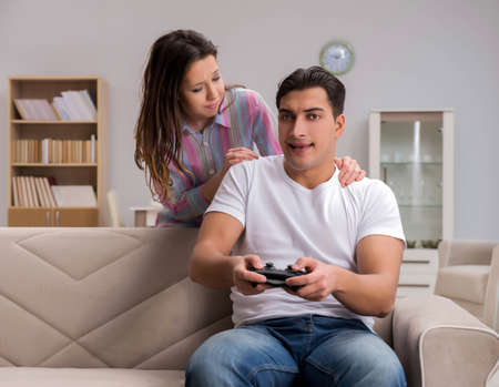 Young family suffering from computer games addiction