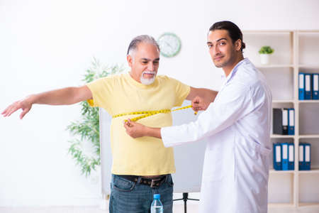 Doctor dietician giving advices to fat overweight patientの写真素材