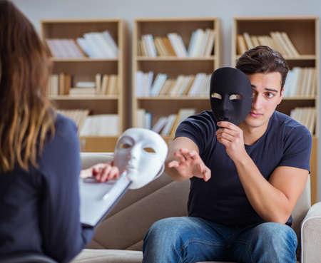 Man attending psychology therapy session with doctorの写真素材