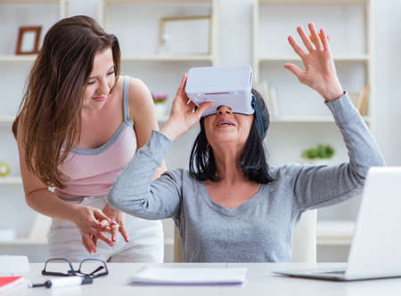 Senior woman experiencing virtual reality glasses