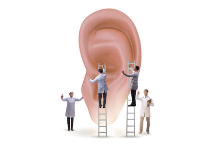 Doctor examining giant ear in medical conceptの写真素材
