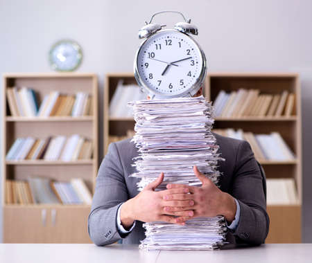 Businessman struggling to meet challenging deadlines