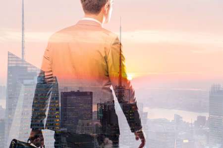 Successful businessman against cityscape in business concept