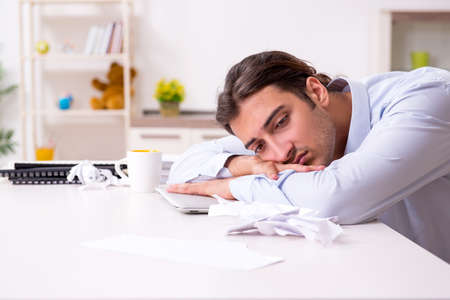 Young male businessman working at homeの写真素材