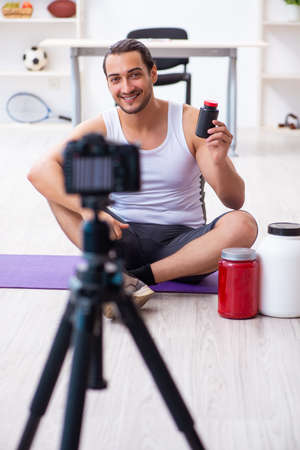Young male blogger in dieting conceptの写真素材