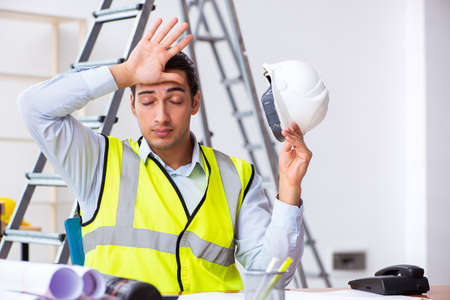 Young male architect working indoorsの写真素材