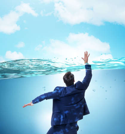 Drowning businessman in insolvency and bankruptcy concept