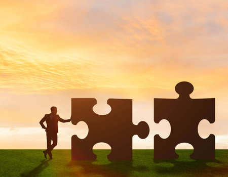 The business metaphor of teamwork with jigsaw puzzleの写真素材