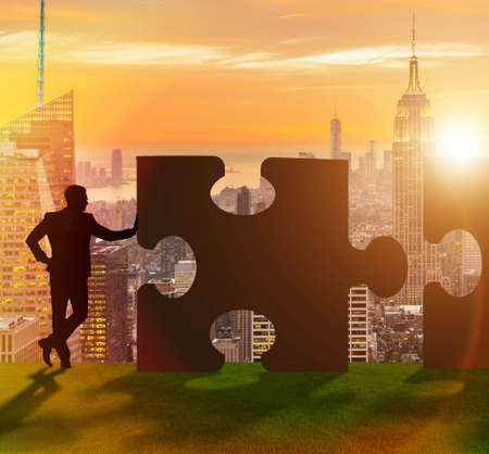 Business concept of teamwork with jigsaw puzzleの写真素材
