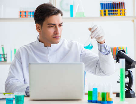 Male chemist working in labの写真素材