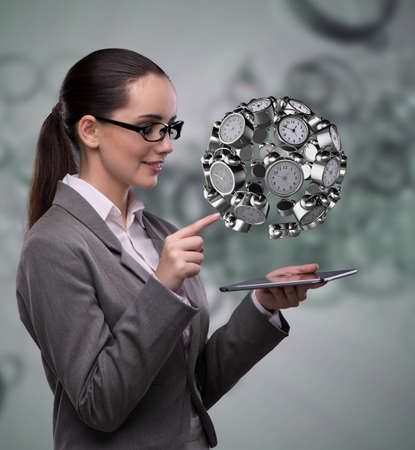 Businesswoman in time management conceptの写真素材