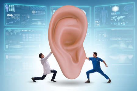The doctor examining giant ear in medical conceptの写真素材
