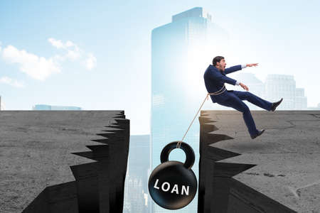 Concept of debt and load with businessmanの写真素材