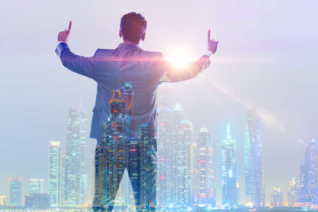 Successful businessman against cityscape in business concept