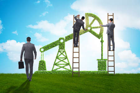 The businessman and green oil energy conceptの写真素材