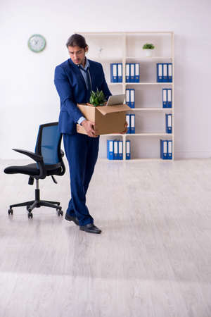 Young man being fired from his workの写真素材