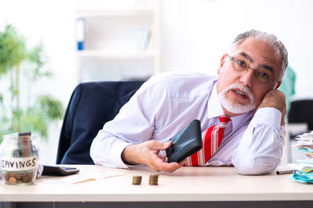 Old male accountant in budget planning concept