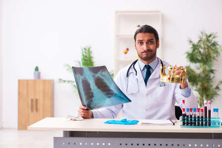 Doctor working in lab in coronavirus COVID-19 conceptの写真素材