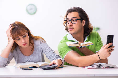 Two students in gadget dependency conceptの写真素材