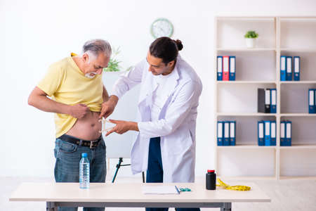 Doctor dietician giving advices to fat overweight patientの写真素材