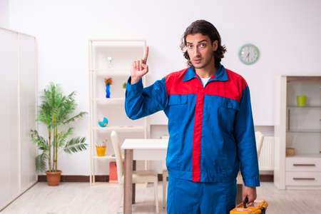 Young male carpenter working indoorsの写真素材