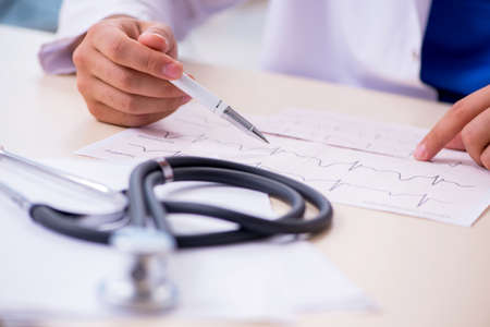 Young doctor cardiologist working in the clinic